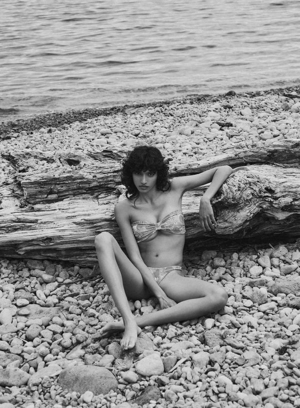 model is wearing floral bikini bottom in jacquard fabric, front view