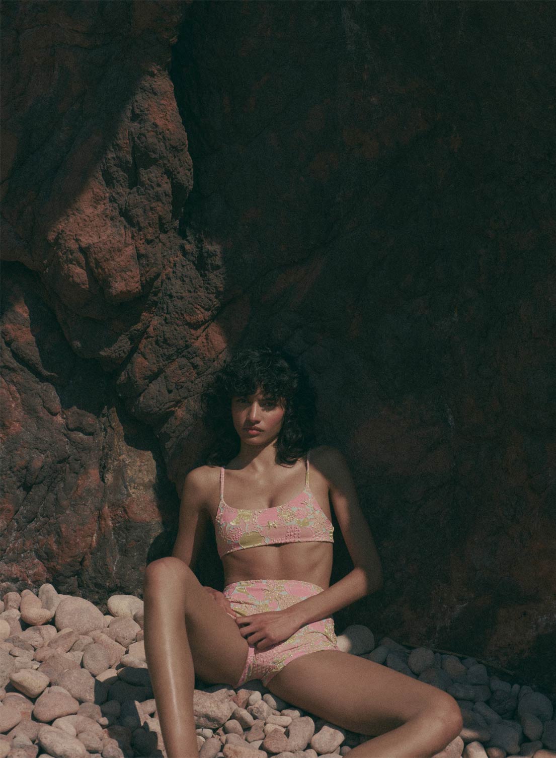 model is wearing pink floral bikini top swimsuit in jacquard fabric, with thin shoulder straps, front view