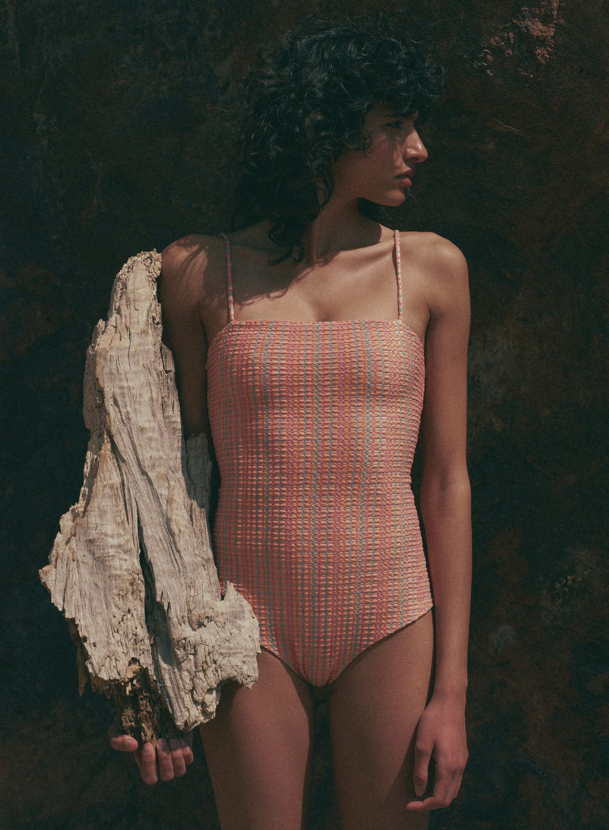 model is wearing orange, multi color one-piece swimsuit with square neckline and thin straps in jacquard fabric, front view
