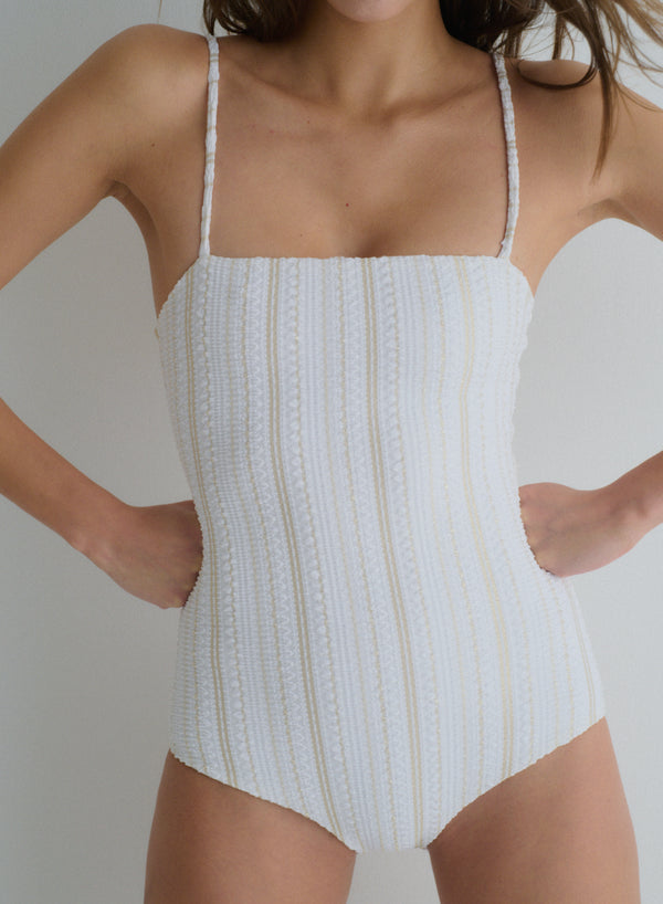 white one-piece swimsuit with thin, shoulder straps in jacquard fabric,  full coverage, front view