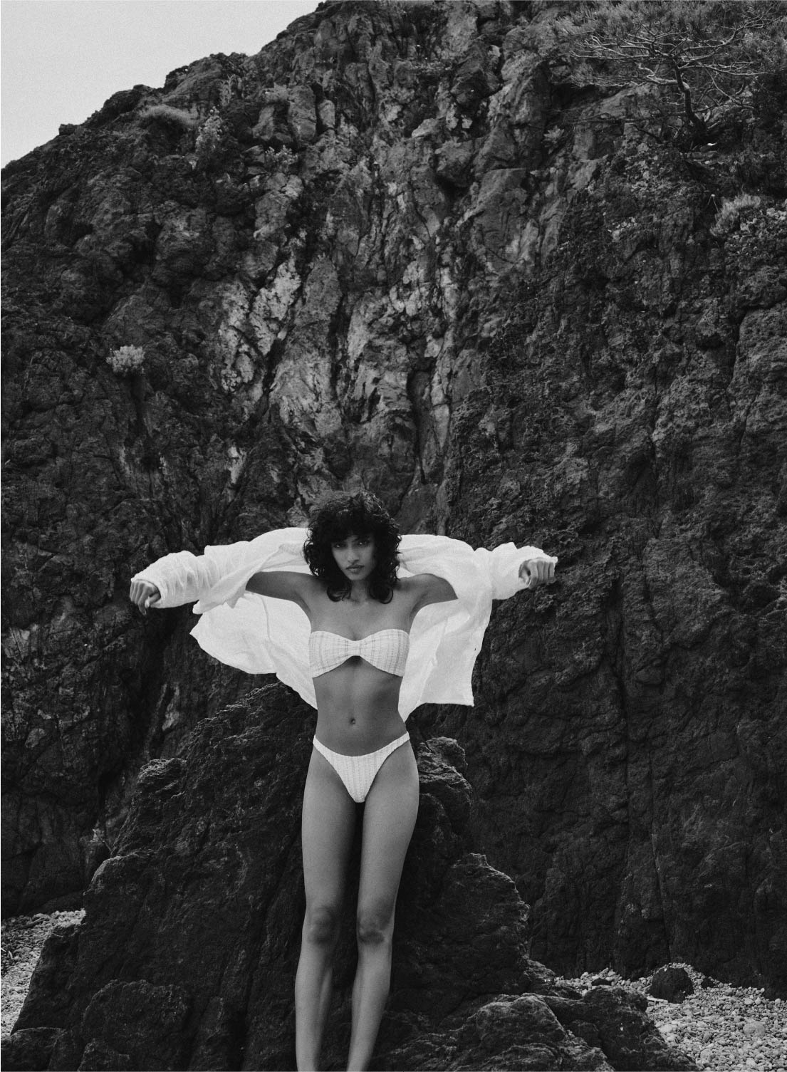 model is wearing white bikini top with front gather in jacquard fabric, front view