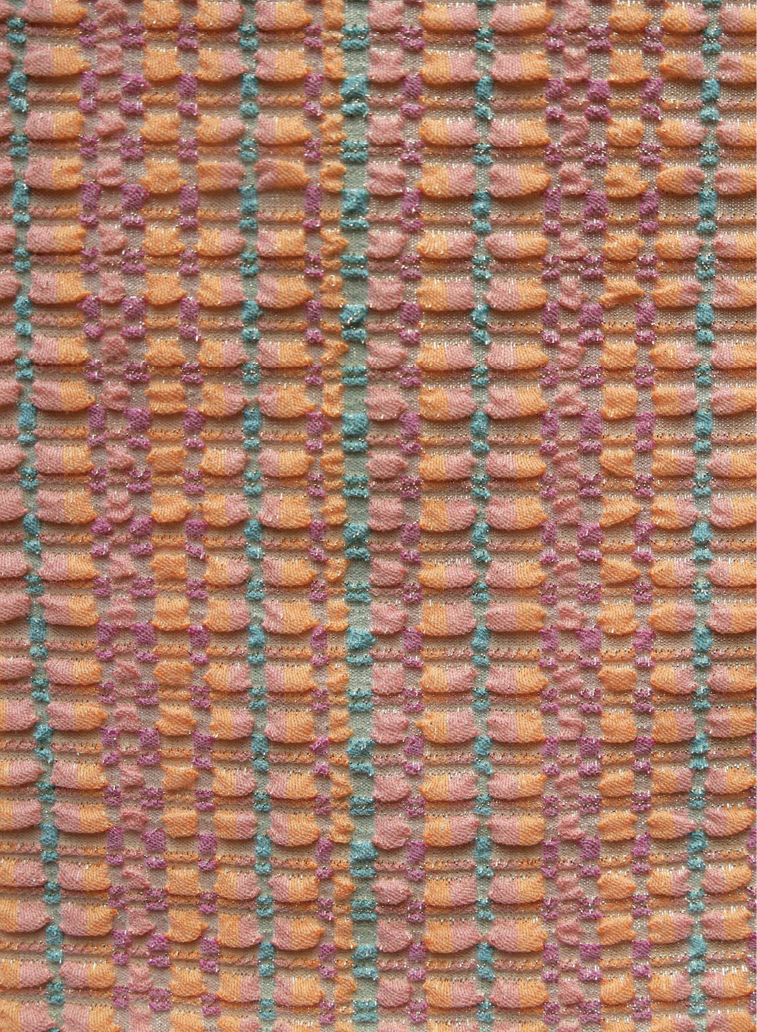 close up of orange with multi color, jacquard swimsuit fabric texture