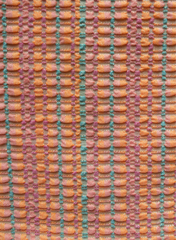 close up of orange with multi color, jacquard swimsuit fabric texture